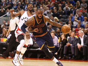 Cleveland's LeBron James blows past Terrence Ross as the Toronto Raptors lost 116-112 to the Cleveland Cavaliers in Toronto, Ont. on Monday December 5, 2016. Michael Peake/Toronto Sun/Postmedia Network