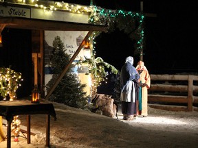 Dozens of performers and scores of watchers came out to experience the annual Living Nativity pageant that was held last Friday. In this scene, Mary tells Elizabeth about her experience with the angel and the fact that she would bear the son of God.