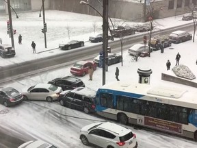 Facebook user Willem Shepherd posted a video of cars, buses and a snowplow sliding down a hill in Montreal on Monday. (Facebook screengrab)