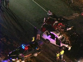 New Jersey State Troopers and police officers work the scene of a crash where a vehicle crashed into a state trooper's vehicle in Millville, N.J., Monday, Dec. 5, 2016. New Jersey State Trooper Frankie Williams, who was injured in the head-on crash, died after he was flown to a hospital. State police said an unidentified driver was pronounced dead at the scene. (WPVI-TV via AP)