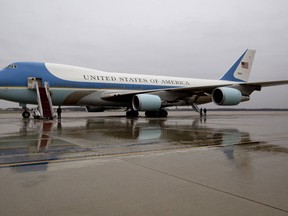 Air Force One is seen on the tarmac at Andrews Air Force Base, Md., Tuesday, Dec. 6, 2016, before President Barack Obama boards en route to MacDill Air Force Base in Tampa, Fla. President-elect Donald Trump wants the government's contract for a new Air Force One canceled. (AP Photo/Carolyn Kaster)
