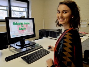 Scarlett Davidson, youth development co-ordinator, mindyourmind.ca, next to a computer running their web-based financial literacy game Bringing Home the Bacon in London Ont. November 25, 2016. CHRIS MONTANINI\LONDONER\POSTMEDIA NETWORK
