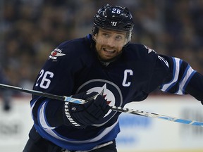 Blake Wheeler chases a loose puck against the Edmonton Oilers last week. With Mark Scheifele out of the lineup again Tuesday night, it's expected Wheeler will be moved to centre. (Kevin King/Winnipeg Sun)