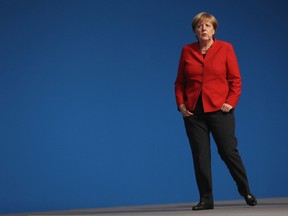 German Chancellor and Chairwoman of the German Christian Democrats (CDU) Angela Merkel walks after she was re-elected with 89.5% of the vote, one of her worst results ever, by delegates as party chairwoman at the 29th federal congress of the CDU on December 6, 2016 in Essen, Germany. Approximately 1,000 CDU delegates are meeting to debate and vote on the party's course for next year following the recent announcement by Merkel that she will run for a fourth term as chancellor in federal elections scheduled for next September. (Photo by Sean Gallup/Getty Images)
