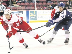 Soo Greyhounds centre and Kingston native Hayden Verbeek, left, is pursued by Sudbury Wolves centre Ryan Valentini during Ontario Hockey League action Oct. 19 at the Essar Centre in Sault Ste. Marie. (JEFFREY OUGLER/POSTMEDIA NETWORK)