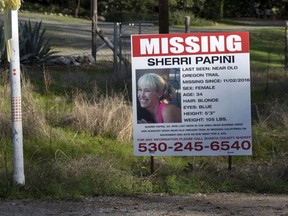 In this Nov. 10, 2016 file photo, a "missing" sign for Mountain Gate, Calif., resident Sherri Papini, 34, is placed along side Sunrise Drive, near the location where the mom of two is believed to have gone missing while on a afternoon jog on Nov. 2. (Andrew Seng/The Sacramento Bee via AP, File)