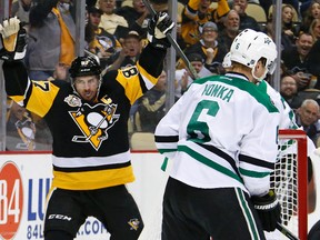 In this Dec. 1, 2016, file photo, Pittsburgh Penguins' Sidney Crosby celebrates his goal in the second period of an NHL hockey game against the Dallas Stars in Pittsburgh. (AP Photo/Gene Puskar, File)