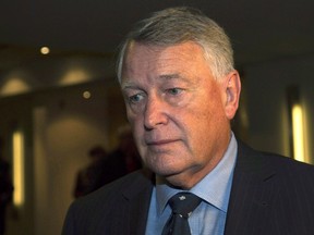 Federal Court Justice Robin Camp leaves a Canadian Judicial Council inquiry in a Calgary hotel, Friday, September 9, 2016. A committee of the Canadian Judicial Council has recommended the removal of a judge over controversial comments he made in a Calgary sex assault trial. (THE CANADIAN PRESS/Todd Korol)