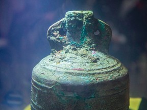 The ship's bell from the recently discovered Franklin Expedition shipwreck HMS Erebus sits in pure water after being recovered in Ottawa on Thursday, Nov. 6, 2014. New research has shed more light on one of Canada's enduring mysteries ??? the fate of the Franklin expedition.Scientists used lasers and high-energy beams from the Canadian Light Source in Saskatoon to illuminate the last few months of the doomed 19th-century British voyage to the Northwest Passage. (THE CANADIAN PRESS/Justin Tang)
