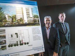 Mike Bateman and Tom Burr, vice-president of multi-family development for One Properties,  with renderings of proposed 28-storey building on site of Wild Earth Foods and Wild Earth Cafe on 99 Street and 89 Avenue on December 5,  2016.  Photo by Shaughn Butts / Postmedia