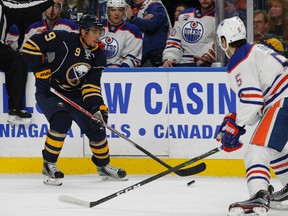 Buffalo Sabres forward Evander Kane (9) carries the puck into the zone during the first period of an NHL hockey game against the Edmonton Oilers, Tuesday, Dec. 6, 2016, in Buffalo, N.Y. (AP Photo/Jeffrey T. Barnes)