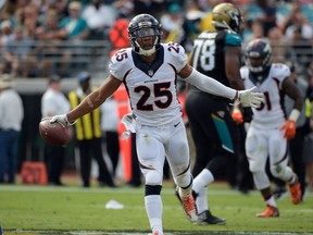 Denver Broncos cornerback Chris Harris celebrates after intercepting a pass against the Jacksonville Jaguars during the first half of an NFL football game in Jacksonville on Dec. 4, 2016. (AP Photo/Phelan M. Ebenhack)