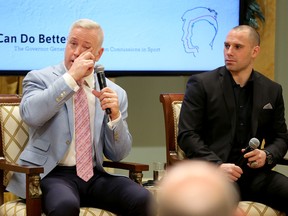 Retired CFL QB Matt Dunigan (left) tears up while talking about the effects of repeated head shots on his life at a federal panel examining concussions in sports. Former CFL player Etienne Boulay (right) told the panel he considered taking his own life after concussions ended his career. (Julie Oliver/Postmedia Network)