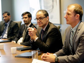 Alberta's Finance Minister Joe Ceci (2nd from right) met with top economic experts from Canada’s financial industry on Wednesday December 7, 2016 to discuss economic forecasts leading up to Budget 2017. LARRY WONG/Postmedia