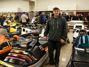 Fourteen-year-old Hugh Scott with his 1973 Boa Ski SS 440 at the fifth annual Snowmobile Expo at the Vermilion Stadium. Taylor Hermiston/Vermilion Standard/Postmedia Network.