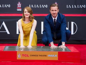 Actors Emma Stone (L) and Ryan Gosling attend 'Ryan Gosling and Emma Stone hand and footprint ceremony' at TCL Chinese Theatre IMAX on December 7, 2016 in Hollywood, California. (Photo by Emma McIntyre/Getty Images)