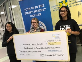 Hunain, left, and Raksheen present a cheque of $1,625 to Keltie Melanson, community partnerships intern with the Sudbury & District Community Office of the Canadian Cancer Society. The money raised will help fund pediatric cancer research. Supplied photo