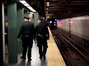 Members of the New York City Police patrol a subway station in Times Square, November 7, 2016 in New York City. (Drew Angerer/Getty Images)