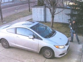 Edmonton police want to speak to this man -- described as a 5-foot-8 Caucasian male with short brown hair wearing a black baseball hat, jeans and a black sweater -- in relation to theft of Christmas decorations in the Summerside neighbourhood. (Supplied/Postmedia)