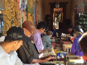 Columnist Wayne Grady, centre, was among the crowd of people at a recent book sale in the courtyard of the Biblioteca Publica in San Miguel de Allende, Mexico. (Merilyn Simonds photo)