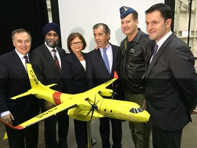 Ernst Kuglin/The Intelligencer
Bay of Quinte MP Neil Ellis, Defence Minister Harjit Sajjan, Public Services and Procurement Minister Judy Foote, Fernando Alonso, head of military aircraft for Airbus Defence and Space, Royal Canadian Air Force Commander, Lt-Gen. Michael Hood and Simon Jacques, head of Airbus Defence and Space Canada Inc. stand behind a model of the C295W, announced Thursday as Canada’s new search and rescue fixed wing aircraft.