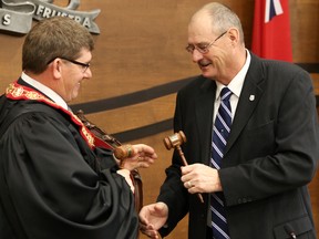 Tim Miller/The Intelligencer
New Hastings County Warden Rodney Cooney exchanges gavels with outgoing warden, Rick Philips, during council's  165th inaugural session on Thursday.