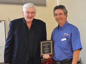 Bill Parks, left, is presented the Meritorious Service Award at the Kent Federation of Agriculture's annual meeting by Scott Kilbride Dec. 8. Held at the University of Guelph Ridgetown Campus, the meeting featured awards, announcements, and discussion on important topics like phosphorous overloading.