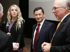Queen’s University business professor Ken Wong, centre, says Kingston can build on the momentum created by recent business announcements on Thursday. (Elliot Ferguson/The Whig-Standard)