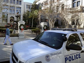 Homeland Security patrol the streets outside the Federal Courthouse Wednesday, Dec. 7, 2016, in Charleston,S.C., during Dylann Roof's trial. Roof, a white man, is accused of killing nine black people at a church. (Grace Beahm/The Post And Courier via AP)