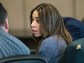 Dalia Dippolito talks with defense attorney Brian Claypool on the second day of testimony in her murder-for-hire retrial Thursday, Dec. 8, 2016, in West Palm Beach, Fla. (Lannis Waters /Palm Beach Post via AP, Pool)