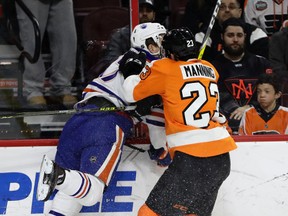 Philadelphia Flyers' Brandon Manning, right, checks Edmonton Oilers' Connor McDavid during the first period of an NHL hockey game, Thursday, Dec. 8, 2016, in Philadelphia.
(AP Photo/Matt Slocum)