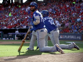 Jose Bautista and Edwin Encarnacion of the Toronto Blue Jays look on in the third inning against the Texas Rangers during Game 1 of the American League Division Series at Globe Life Park in Arlington on Oct. 6, 2016. (Ronald Martinez/Getty Images)