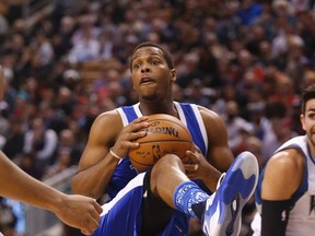 Toronto Raptors' Kyle Lowry clutches the ball during a game against the Minnesota Timberwolves in Toronto on Dec. 8, 2016. (Michael Peake/Toronto Sun/Postmedia Network)