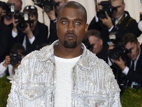 Kanye West arrives at The Metropolitan Museum of Art Costume Institute Benefit Gala, celebrating the opening of "Manus x Machina: Fashion in an Age of Technology" in New York.(Evan Agostini/Invision/AP)
