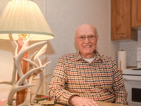 Wood worker Al Bendick next to his favourite deer antler lamp at St. Michael’s Grove Manor in Spruce Grove on Thursday, Dec. 1, 2016 - Photo by Yasmin Mayne.