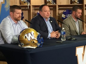 Bombers coach Mike O'Shea (left), Wade Miller (centre), and GM Kyle Walters speak at a press conference on Friday, Dec. 9, 2016. O'Shea and Walters were signed to new three-year deals by the team. It’s this Canuck trio that has turned the Winnipeg franchise around — getting it to the playoffs for the first time in five years last season — and leads the Bombers into their 2017 season opener in Regina on Saturday, July 1, which also happens to be Canada’s 150th birthday.(CHRIS PROCAYLO/WINNIPEG SUN/POSTMEDIA NETWORK)