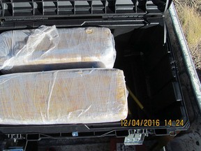 Two of the five large packages of marijuana found in the back of a pickup truck during a drug bust in Payson, Ariz. (Arizona Department of Public Safety/HO)