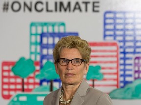 Ontario Premier Kathleen Wynne announces a cap and trade deal with Quebec aimed at curbing green house gas emissions, in Toronto in April 2015. The plan comes into effect on Jan. 1, 2017. (Canadian Press file photo)