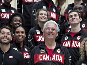 Canadian national head coach Peter Eriksson stands with athletes and coaches for a photo op in Edmonton in a July 11, 2016, file photo. (THE CANADIAN PRESS/Jason Franson)