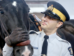 Constable Mathieu Crousset - and a horse named Gus -just completed their six-month training with the RCMP Musical Ride and were part of a small parade for friends and family to demonstrate their skills at the Musical Ride stables in Ottawa  (Julie Oliver, Postmedia)