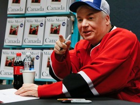 Mike Myers signs copies of his new book, Canada. (Postmedia Network)