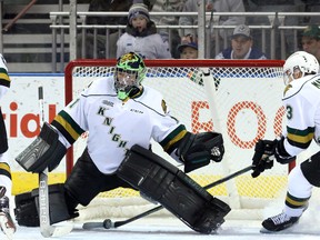 London Knights defenceman Nicolas Mattinen stops a rolling puck from crossing the goal-line. Knights goaltender Tyler Parsons lost sight of the rubber after it hit a post during an Ontario Hockey League game against the Mississauga Steelheads at Budweiser Gardens on Friday. The Steelheads won 7-3. (CRAIG GLOVER, The London Free Press)