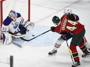 Edmonton Oilers goalie Cam Talbot, left, stops a shot by Minnesota Wild's center Tyler Graovac during the first period of an NHL hockey game, Friday, Dec. 9, 2016, in St. Paul, Minn.