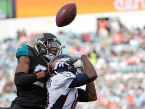 In this Dec. 4, 2016, file photo, Jacksonville Jaguars cornerback Jalen Ramsey breaks up a pass intended for Denver Broncos wide receiver Emmanuel Sanders during the second half of an NFL football game in Jacksonville, Fla. (AP Photo/Phelan M. Ebenhack, File)