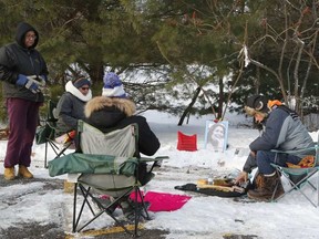 Friends hold a vigil for Kelly Morrisseau, whose murdered body was found in Gatineau Park 10 years ago. Patrick Doyle/Ottawa Sun