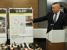 EPS Staff Sgt. Dave Knibbs speaks at an Alberta Law Enforcement Response Teams press conference announcing arrests and charges relating to ATM thefts in Edmonton, Alberta on Tuesday, October 18, 2016. Ian Kucerak / Postmedia