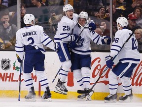 Toronto Maple Leafs' Auston Matthews celebrates his goal with teammates during the second period of an NHL game against the Boston Bruins in Boston on Dec. 10, 2016. (AP Photo/Michael Dwyer)