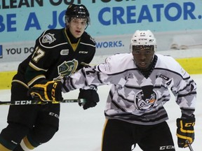 Sarnia Sting winger Jaden Lindo directs traffic with London Knights centre Robert Thomas nearby during the Ontario Hockey League game at Progressive Auto Sales Arena on Saturday, Dec. 10, 2016 in Sarnia, Ont. Lindo returned to the lineup after a 10-game absence due to a shoulder injury. Terry Bridge/Sarnia Observer/Postmedia Network