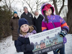 A group of residents gathered in Stanley Park area to express how upset about the city's plan to use much of the park as construction zone Sunday December 11, 2016. For a couple of years, it will be the major staging area for this Overflow Sewage System that is being built in a six-kilometre stretch across Ottawa. From left, front row: Sophie Slinn, 3, and Yasmin Dhanani, 7, beind them, from left: Lillian Lai, David Slinn and Victoria Henry. ASHLEY FRASER / POSTMEDIA