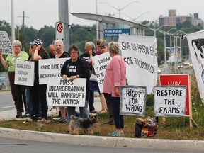 Save Our Prison Farms supporters protest outside Frontenac Institution in August 2015. The group feels encouraged after meeting with Kingston MP Mark Gerretsen on Friday. (Whig-Standard file photo)